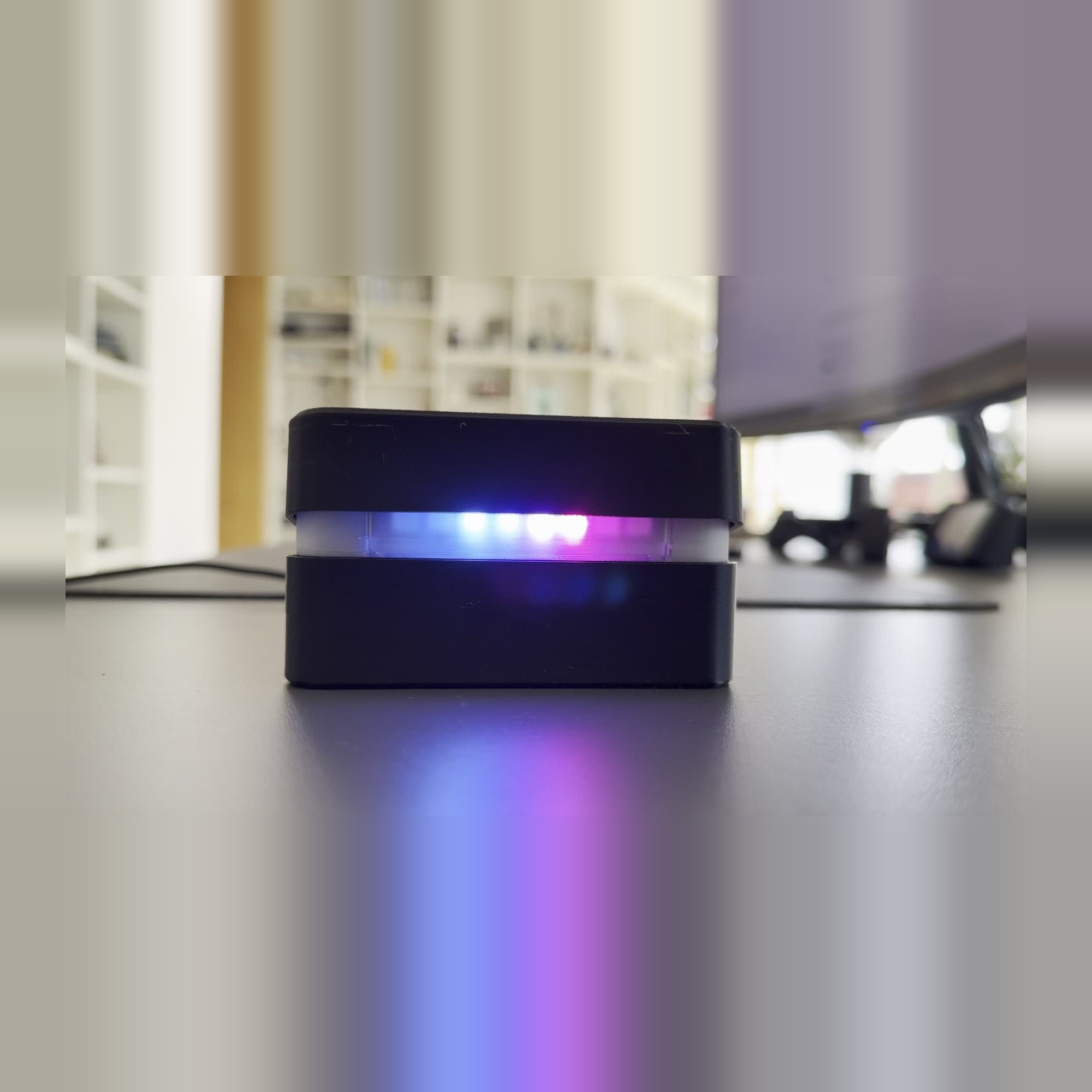 Top lifted, frosted LED band lit (cool colours)